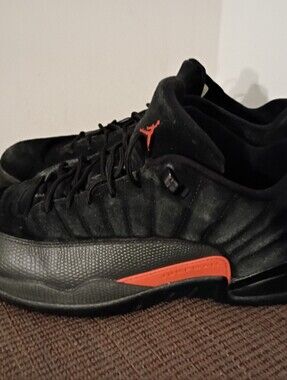 Air Jordan 14 Retro Low-Top Sneakers in Black with Red Accents.